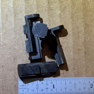 U.S. M1 Carbine magazine catch marked with a large sideways "8", #309-40-7